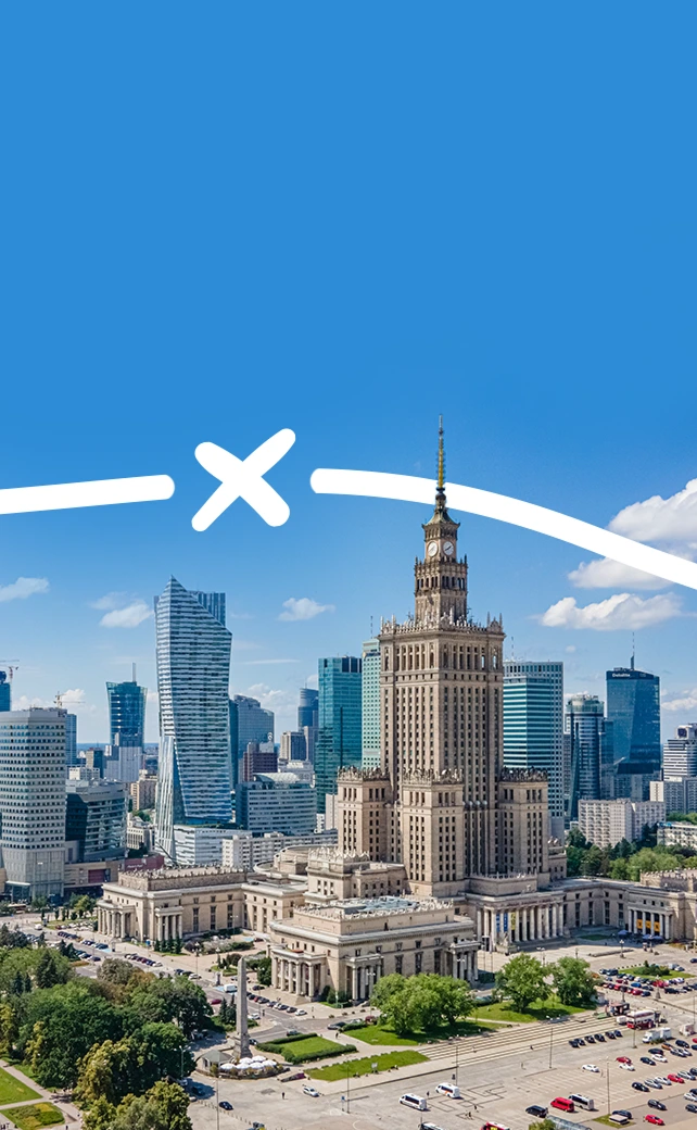 An elevated, wide-angle aerial photograph capturing the detailed, historic architecture of the Palace of Culture and Science in Warsaw, Poland.